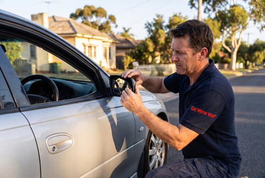 Car Mirror Man technician replacing a car side mirror in Melbourne